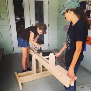 As a service project and part of their woodworking class, the Saltmeadow students built a seesaw for the early childhood students at the Mangrove School of Sarasota.